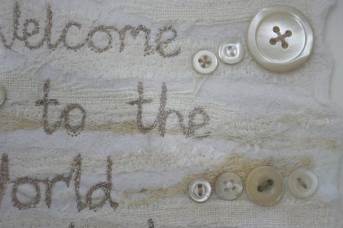 Welcome to the world - close up on writing and buttons