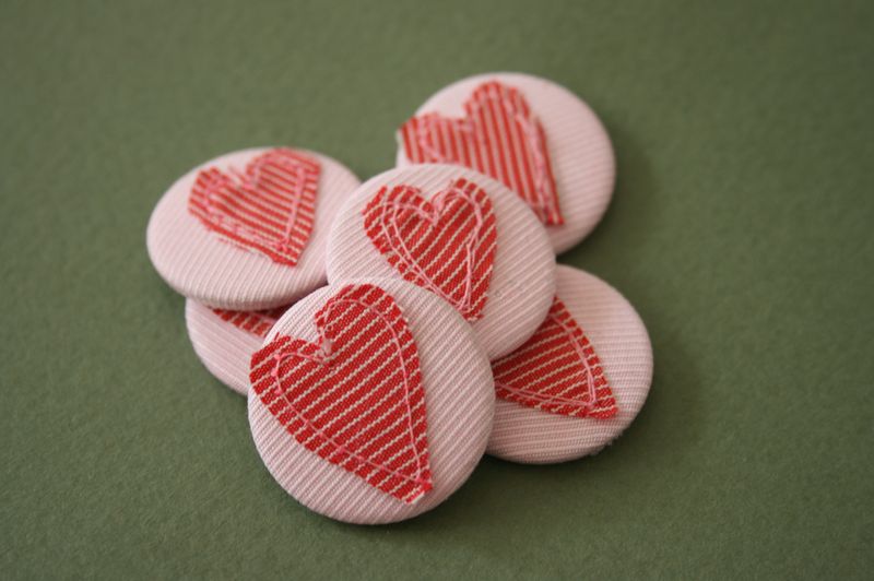 Heart badges in group on green background